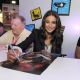 Emmanuelle Chriqui, who voices Cheetara, signs posters at a “Thundercats” event