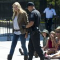 Police officers arrest American actress Daryl Hannah during a protest against the construction of the Keystone XL pipeline, outside the White House in Washington, DC, August 30, 2011
