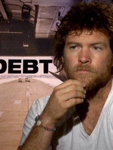Sam Worthington Takes On ‘The Debt’