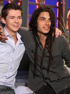 “The Glee Project” winners Damian McGinty and Samuel Larsen share a hug on the set of Access Hollywood Live on August 22, 2011