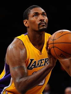 Ron Artest #15 of the Los Angeles Lakers shoots a free throw while taking on the New Orleans Hornets in Game Two of the Western Conference Quarterfinals in the 2011 NBA Playoffs on April 20, 2011 