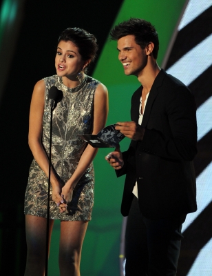 Selena Gomez and Taylor Lautner speak onstage during the 2011 MTV Video Music Awards at Nokia Theatre L.A. LIVE in Los Angeles, on August 28, 2011 