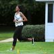 Michelle Obama runs while working out with local students on the South Lawn of the White House on May 25, 2010 in Washington, DC