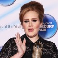 Adele holds her award at the Barclaycard Mercury Music Prize 2011 at the Grosvenor House, London, Sept. 6, 2011