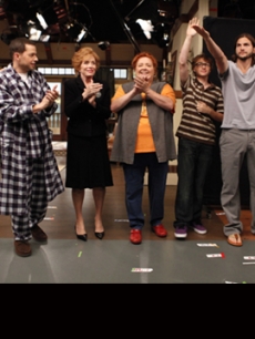 Ashton Kutcher waves during the curtain call after filming the season premiere episode of “Two and a Half Men,” alongside Marin Hinkle, Jon Cryer, Holland Taylor, Conchata Ferrell and Angus T. Jones