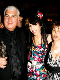 Amy Winehouse, her father Mitch and mother Janis pose with Amy’s award for Best Song Musically and Lyrically for ‘Love Is A Losing Game’ at the 53rd Ivor Novello Awards at the Grosvenor House Hotel, London, on May 22, 2008 