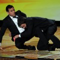 Jimmy Kimmel and Jimmy Fallon wrestle onstage during the 63rd Annual Primetime Emmy Awards held at Nokia Theatre