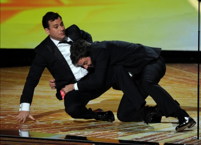 Jimmy Kimmel and Jimmy Fallon wrestle onstage during the 63rd Annual Primetime Emmy Awards held at Nokia Theatre