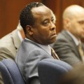 Dr. Conrad Murray watches Alberto Alvarez, one of Michael Jackson’s security guards, testify during his involuntary manslaughter trial at the Los Angeles Superior Court in downtown Los Angeles on September 29, 2011 