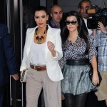 Kim Kardashian and Kourtney Kardashian are surrounded by photographers as they leave their Midtown Manhattan hotel in NYC on October 7, 2011