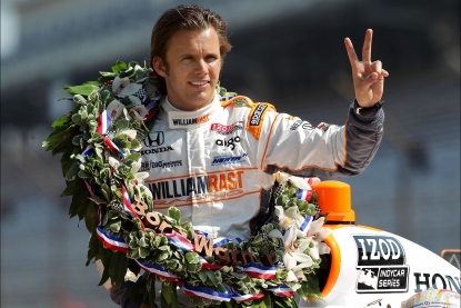 Dan Wheldon, driver of the #98 William Rast-Curb/Big Machine Dallara Honda gestures to photographers during the 95th Indianapolis 500 Mile Race Trophy Presentation at Indianapolis Motor Speedway in Indianapolis on May 30, 2011 
