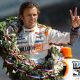 Dan Wheldon, driver of the #98 William Rast-Curb/Big Machine Dallara Honda gestures to photographers during the 95th Indianapolis 500 Mile Race Trophy Presentation at Indianapolis Motor Speedway in Indianapolis on May 30, 2011 