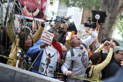 Passionate Michael Jackson fans line the streets outside of the Los Angeles Superior Courthouse awaiting a verdict in Downtown Los Angeles on November 7, 2011