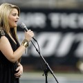 Lauren Alaina performs the National Anthem before the Green Bay Packers take on the Detroit Lions during the Thanksgiving Day game at Ford Field, Detroit, November 24, 2011