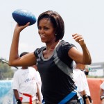 Michelle Obama throws a football at Brock Elementary School in New Orleans, Louisiana, on September 8, 2010 