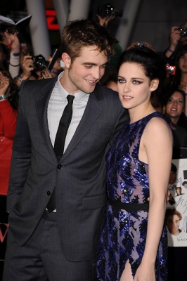 Robert Pattinson looks at his co-star, Kristen Stewart, while at the premiere of ‘The Twilight Saga: Breaking Dawn — Part 1’ at the Nokia Theatre L.A. Live, Los Angeles, Nov. 14, 2011