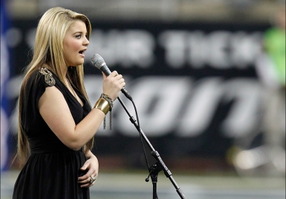 Lauren Alaina performs the National Anthem before the Green Bay Packers take on the Detroit Lions during the Thanksgiving Day game at Ford Field, Detroit, November 24, 2011