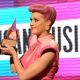 Katy Perry accepts an award onstage during the American Music Award at the Nokia Theatre L.A. LIVE in Los Angeles on November 20, 2011 