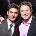 Zac Efron and Billy Bush hug it out on the red carpet at the ‘New Year’s Eve’ premiere in Hollywood on December 5, 2011