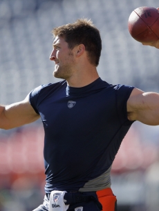 Tim Tebow, #15 of the Denver Broncos, warms up prior to the game against the Chicago Bears at Sports Authority Field at Mile High, Denver, on December 11, 2011