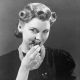 A woman eats a chocolate