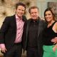Regis Philbin poses with Billy Bush and Kit Hoover on Access Hollywood Live on November 30, 2011