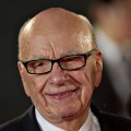 Rupert Murdoch poses on the red carpet during the opening ceremony of the Shanghai International Film Festival in Shanghai on June 11, 2011