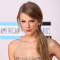 Taylor Swift arrives at the 2011 American Music Awards held at Nokia Theatre L.A. LIVE in Los Angeles on November 20, 2011