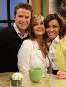Billy Bush, Bo Derek and Kit Hoover smile on Access Hollywood Live on January 11, 2012