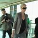 Charlize Theron knows how to travel in style, as she’s spotted walking through London’s Heathrow Airport on March 29, 2011
