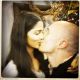 Camila Alves and Matthew McConaughey share a kiss in front of the Christmas tree. Photo Credit: Matthew McConaughey / WhoSay.com