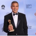 George Clooney poses with the trophy for Best Actor in a Motion Picture, Drama at the 69th annual Golden Globe Awards at the Beverly Hilton Hotel in Beverly Hills