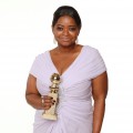 The winner for Best Performance by an Actress in a Supporting Role in a Motion Picture Octavia Spencer poses with the trophy at the 69th annual Golden Globe Awards at the Beverly Hilton Hotel in Beverly Hills, January 15, 2012