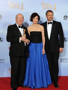 Writer Julian Fellowes, actors Elizabeth McGovern and Hugh Bonneville pose in the press room with the Best Mini-Series or Motion Picture Made for Television award for ‘Downtown Abbey’ at the 69th Annual Golden Globe Awards held at the Beverly Hilton Hotel, Beverly Hills, on January 15, 2012