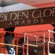 Workers prepare the red carpet arrivals area the 68th Annual Golden Globe Awards, outside the Beverly Hilton Hotel in Beverly Hills, California January 14, 2011