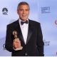 George Clooney poses with the trophy for Best Actor in a Motion Picture, Drama at the 69th annual Golden Globe Awards at the Beverly Hilton Hotel in Beverly Hills
