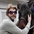 Animal enthusiast/‘The Crazy Nastyass Honey Badger’ creator Randall poses with a horse