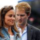 Pippa Middleton with George Percy leaves centre court as rain delays play during the Men’s Singles third round match between Andy Roddick of the United States and Kevin Anderson of South Africa on day four of the AEGON Championships at Queens Club, London, on June 9, 2011