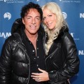 Neal Schon of Journey and girlfriend Michaele Salahi attend the 110th NAMM Show - Day 2 at the Anaheim Convention Center, Anaheim, Calif., on January 20, 2012