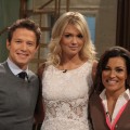 Kate Upton poses with Billy Bush and Kit Hoover on the set of Access Hollywood Live on February 21, 2012