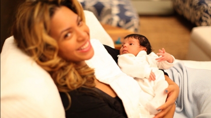 Beyonce holds baby Blue Ivy Carter in a photo posted on Jay-Z’s site LifeAndTimes.com
