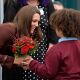Eight-year-old Jaqson Johnston-Lynch presents Catherine, Duchess of Cambridge a posey of red roses and Valentine’s Day present after her visit to charity The Brink, an alcohol-free bar which is a social enterprise run primarily to help people recovering from drink and drug addiction in Liverpool, England on February 14, 2012