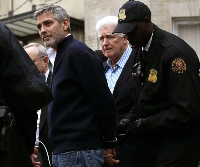 George Clooney is arrested during a demonstration outside the Embassy of Sudan on March 16, 2012 in Washington, D.C. 