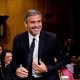 George Clooney smiles as he testifies at the Senate Foreign Relations Sudan and South Sudan: Independence and Insecurity hearing at the Dirksen Senate Office Building in Washington, D.C. on March 14, 2012 