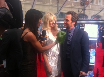 Shaun Robinson shows her superhero strength to Mark Ruffalo at the premiere of ‘The Avengers’ in Hollywood on April 11, 2012 