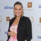 Molly Sims show off her baby bump at the Rosie Pope Maternity Store Opening Event at Rosie Pope Maternity in Santa Monica, Calif. on March 29, 2012 