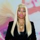 Nicki Minaj poses at a CD signing of her new release ' Pink Friday: Roman Reloaded’ at the f.y.e. music store, Philadelphia, on April 4, 2012