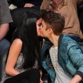 Pucker up! Selena Gomez and Justin Bieber kiss at a basketball game between the San Antonio Spurs and the Los Angeles Lakers at Staples Center in Los Angeles on April 17, 2012 