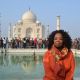Oprah Winfrey poses in front of the Taj Mahal on January 19, 2012