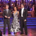 Tom Bergeron, Cheryl Burke and WIlliam Levy try to hear the judges over the roar of the crowd during Week of ‘Dancing with the Stars,’ May 7, 2012